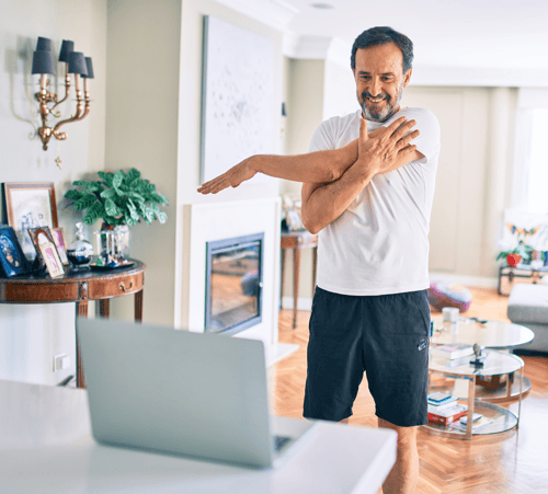 Man talking to a physical therapist in a virtual telehealth session